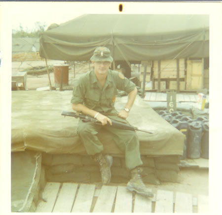 Gela_1969_Mercer_sitting_on_bunker_fs